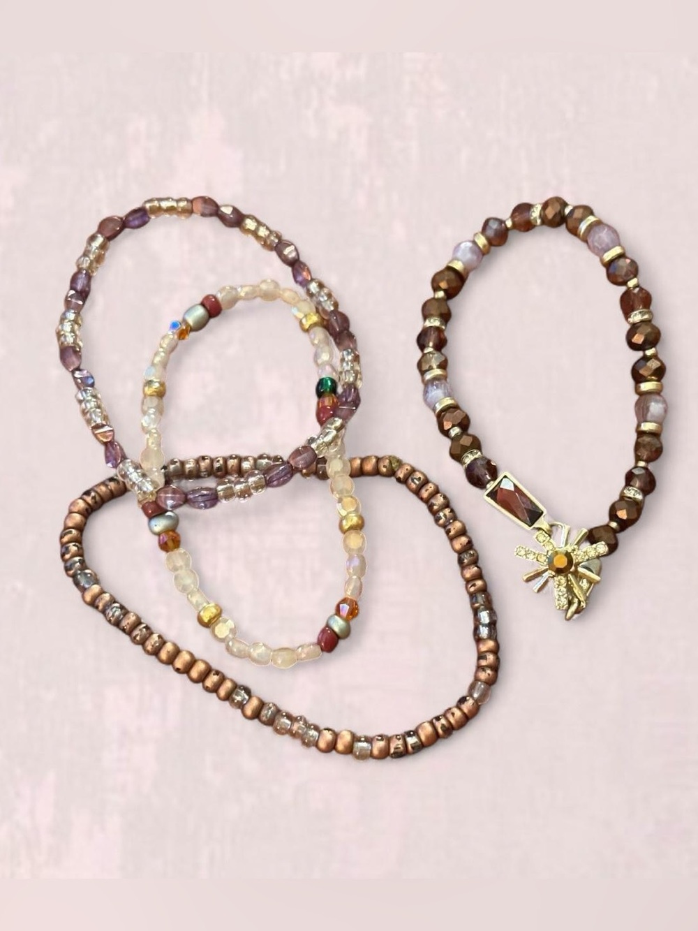 Set of 4 Women’s Beaded Bracelets in Brown Purpoe and Gold Tones.